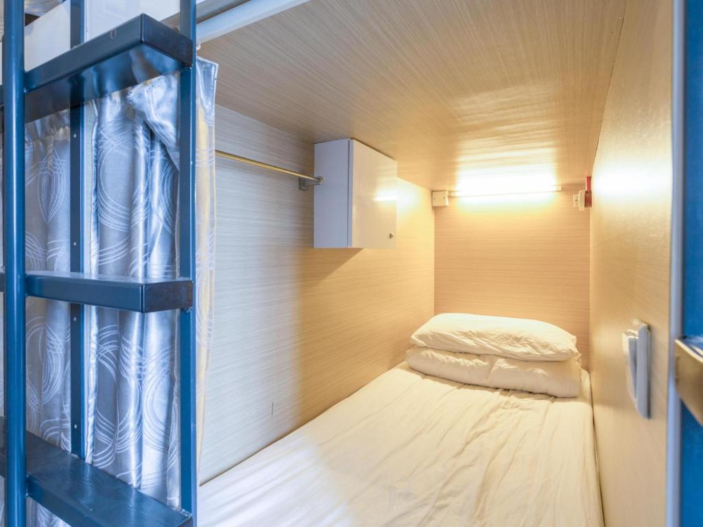 Postel nebo postele na pokoji v ubytování K2 Guesthouse Central