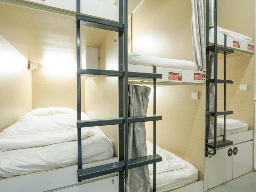 Postel nebo postele na pokoji v ubytování K2 Guesthouse Central