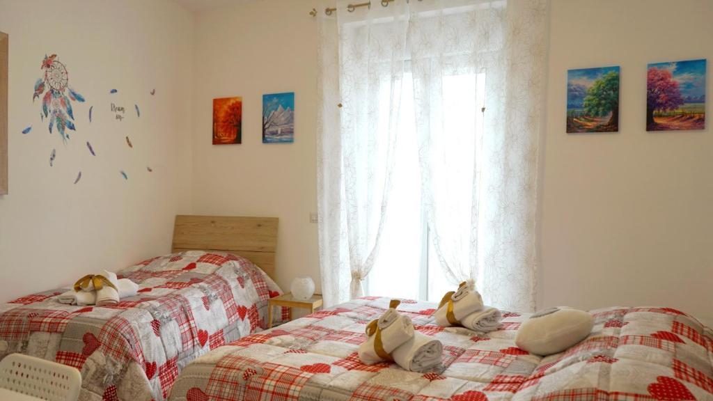 Łóżko lub łóżka w pokoju w obiekcie La Lanterna Sul Comò