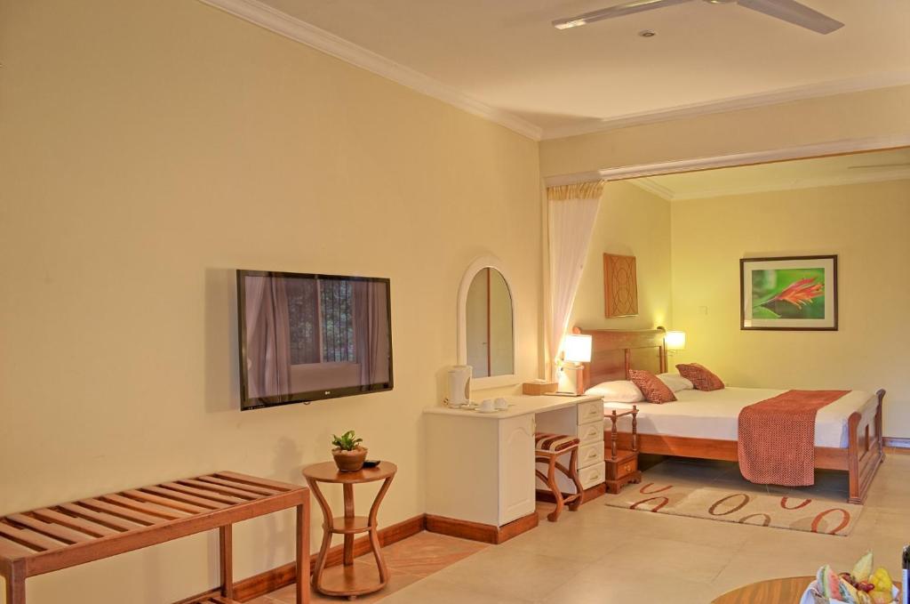Postel nebo postele na pokoji v ubytování Sovereign Hotel