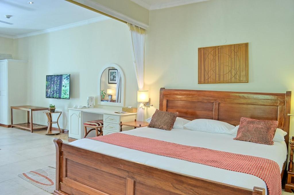 Postel nebo postele na pokoji v ubytování Sovereign Hotel