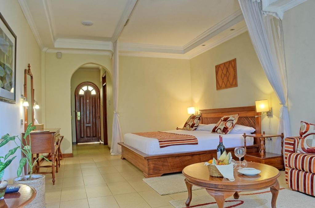 Postel nebo postele na pokoji v ubytování Sovereign Hotel