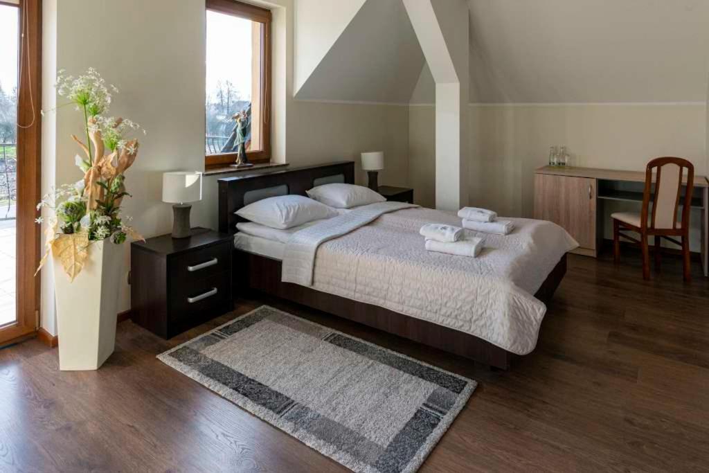 Cama o camas de una habitación en Dom Grinholc