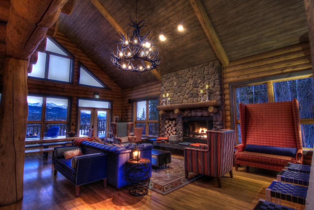 a living room filled with furniture and a fire place at The Bivvi Hostel in Breckenridge