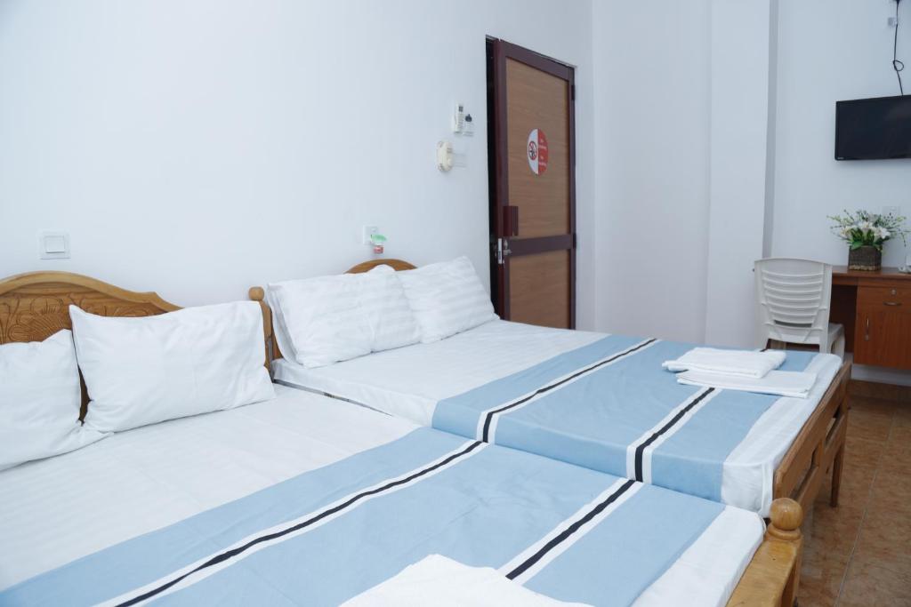 Katil atau katil-katil dalam bilik di Hotel Juli Reception
