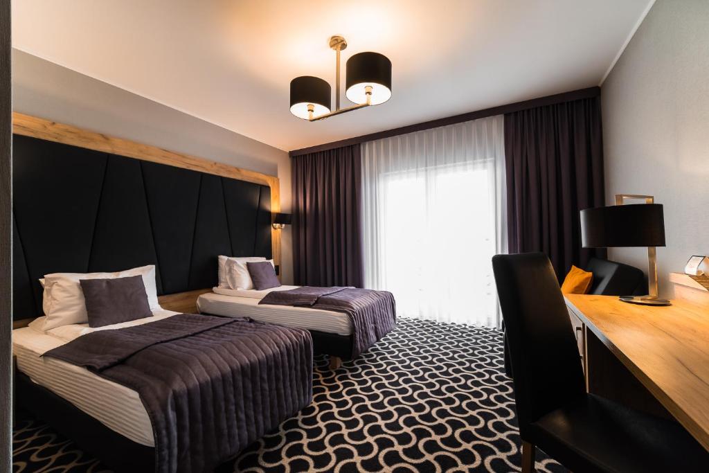 Postel nebo postele na pokoji v ubytování Hotel Coloseum
