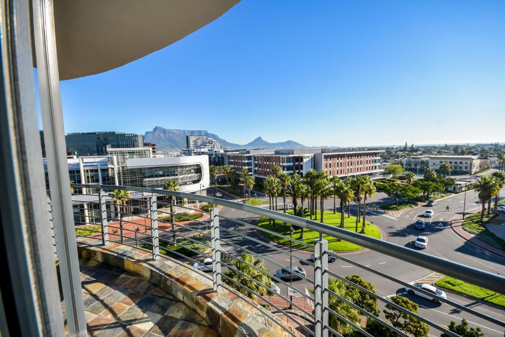 a view of the city from the balcony of a building at Colosseum Hotel in Cape Town
