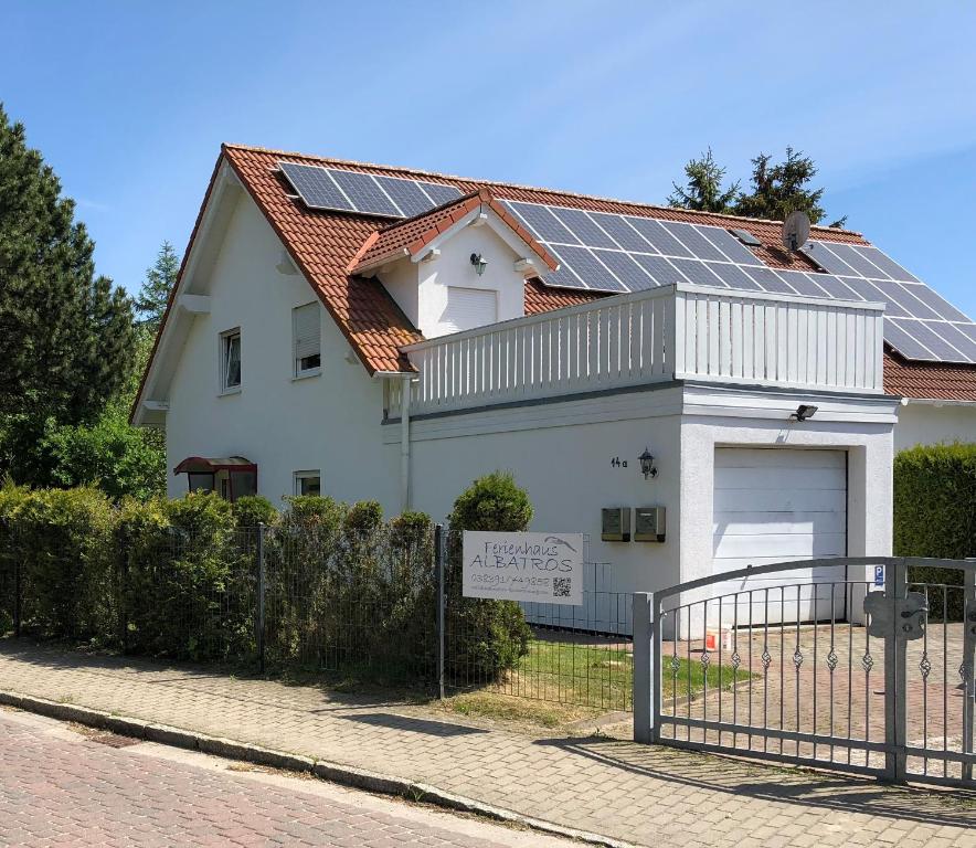a house with solar panels on the roof at Ferienwohnung Insel Rügen - Haus Albatros in Altenkirchen