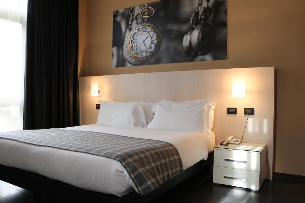 Postel nebo postele na pokoji v ubytování Hotel Garibaldi
