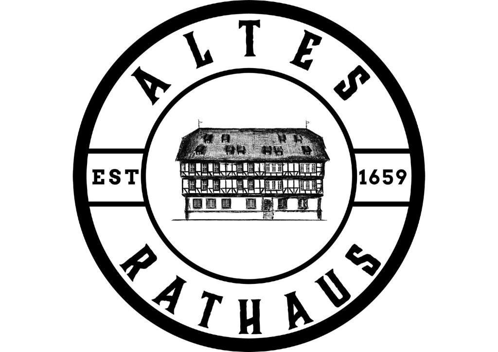 沃爾夫根的住宿－Altes Rathaus Hotel-Restaurant-Café，印有法院的印章,带有写有隐式隐居文字的印章