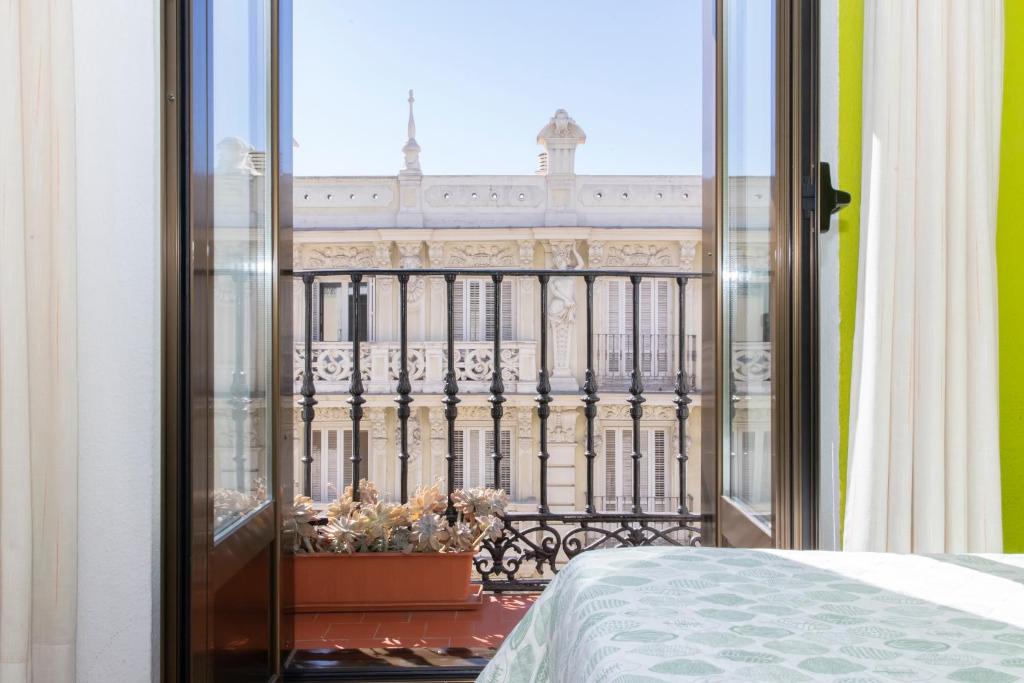 Postel nebo postele na pokoji v ubytování Hostal Rober