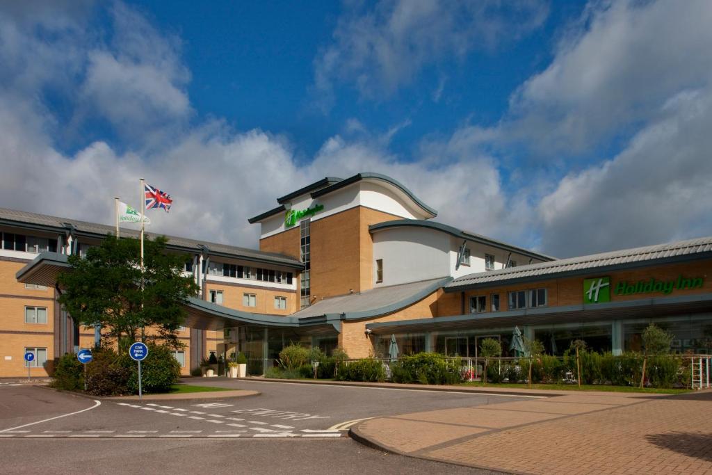 an airplane is parked in front of a building at Holiday Inn Oxford, an IHG Hotel in Oxford