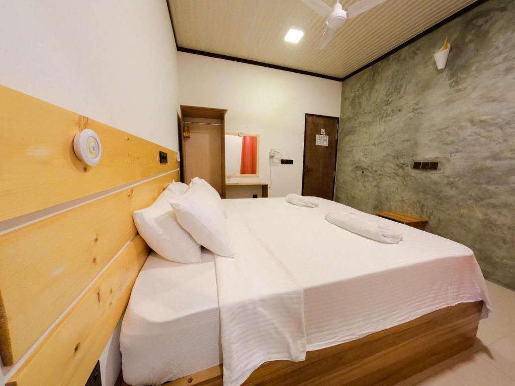 Postel nebo postele na pokoji v ubytování Huvan Inn