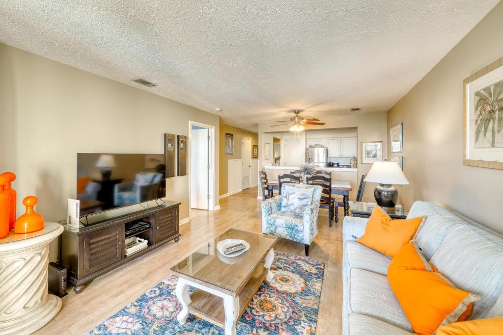 a living room with a couch and a table at Summer House 309 in Isle of Palms