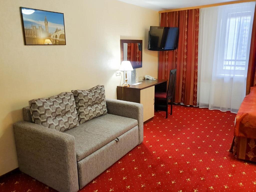 TV a/nebo společenská místnost v ubytování AMAKS Safar Hotel