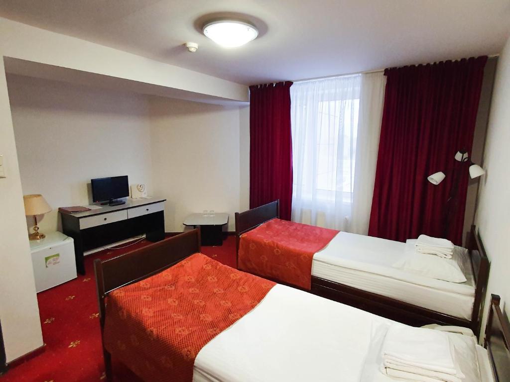 Postel nebo postele na pokoji v ubytování AMAKS Safar Hotel
