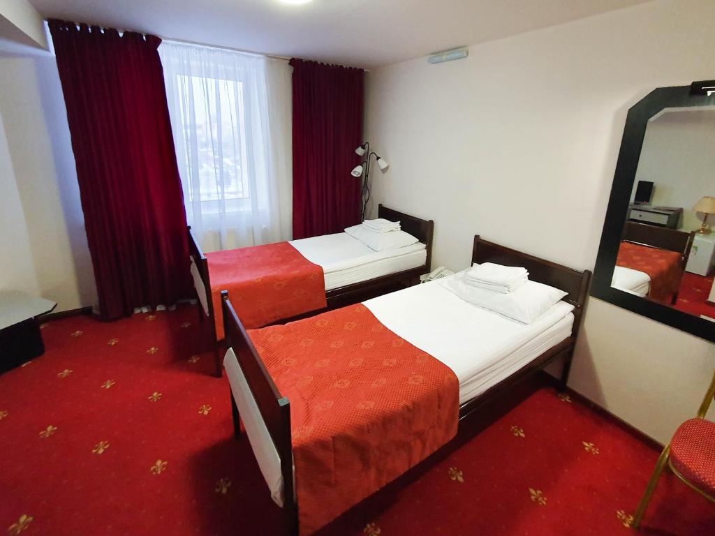 Postel nebo postele na pokoji v ubytování AMAKS Safar Hotel