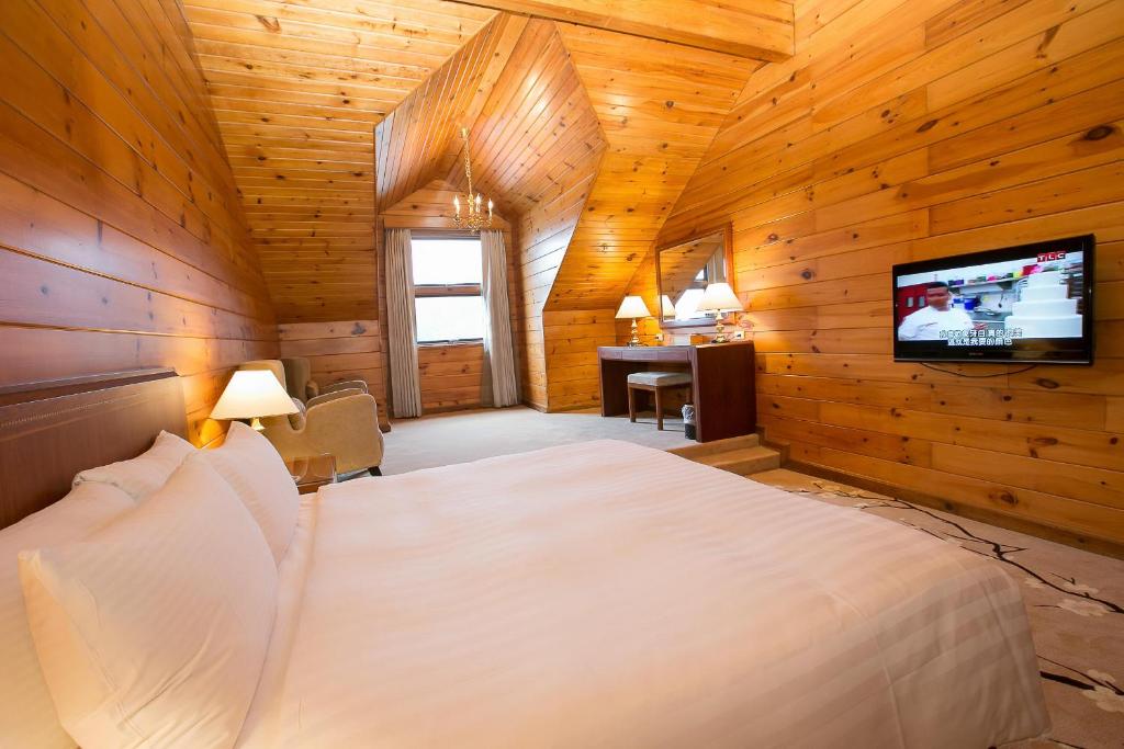 Postel nebo postele na pokoji v ubytování The Richforest Hotel- Sun Moon Lake