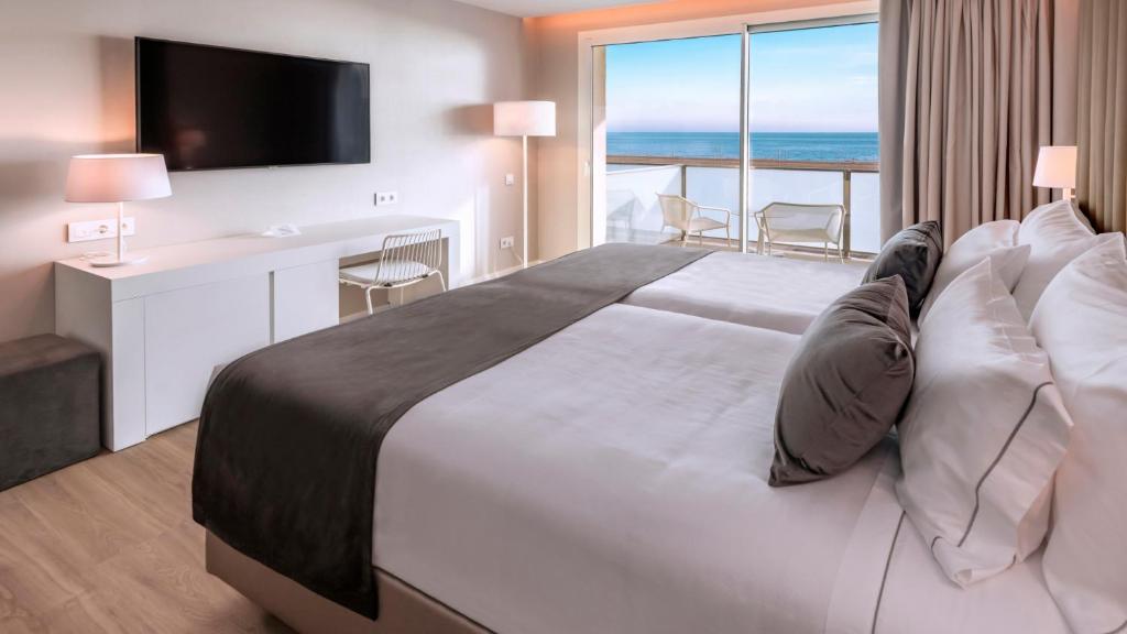 Postel nebo postele na pokoji v ubytování Hotel Playafels