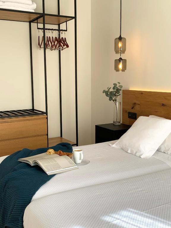 A bed or beds in a room at Hotel Boutique Astorga