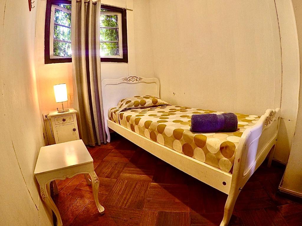 Postel nebo postele na pokoji v ubytování Hostal Providencia