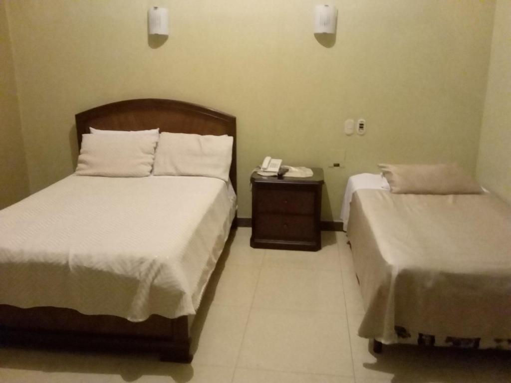 Cama o camas de una habitación en Hostal Cristhian Inn