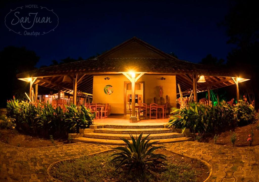 a house with a patio at night with lights at Hotel San Juan Ometepe in Altagracia