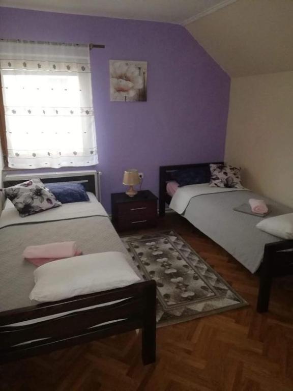 Posteľ alebo postele v izbe v ubytovaní Apartman Nika