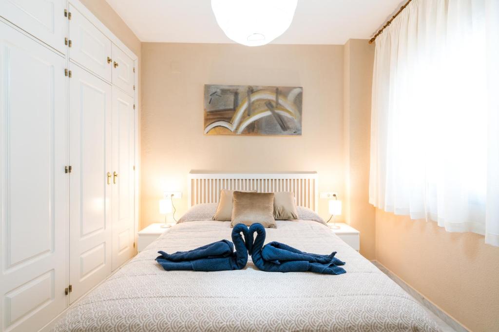 Postel nebo postele na pokoji v ubytování Céntrico II Donkey Parking incluido