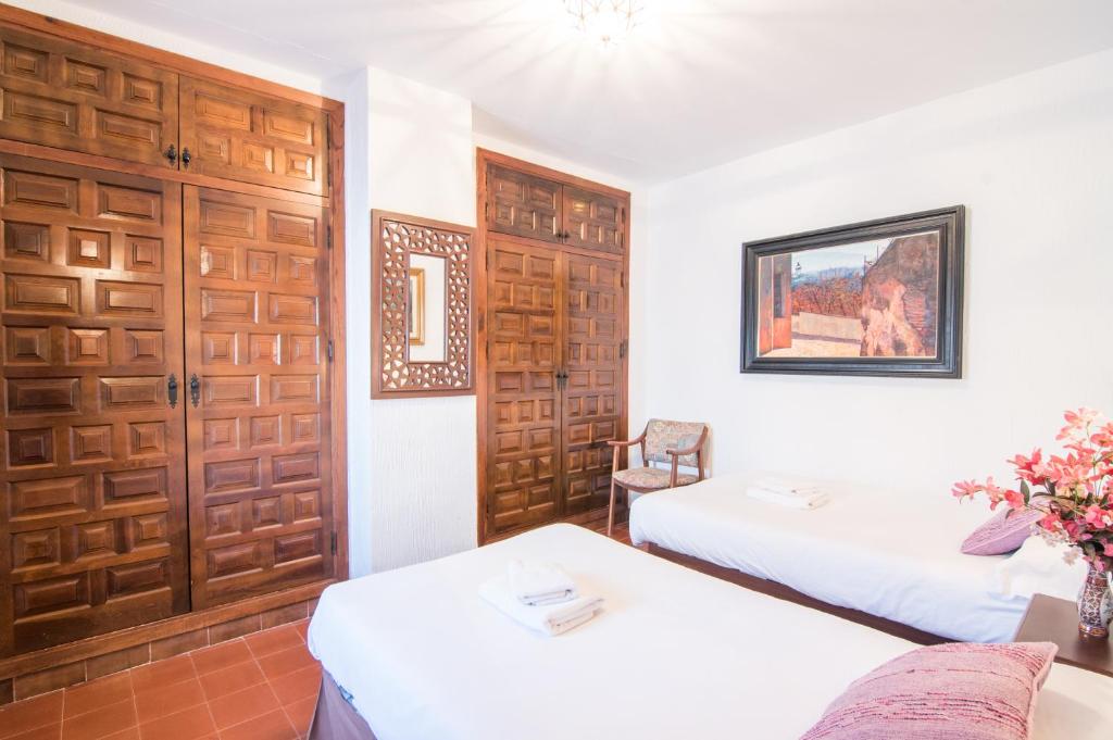 Postel nebo postele na pokoji v ubytování Country House Monachil