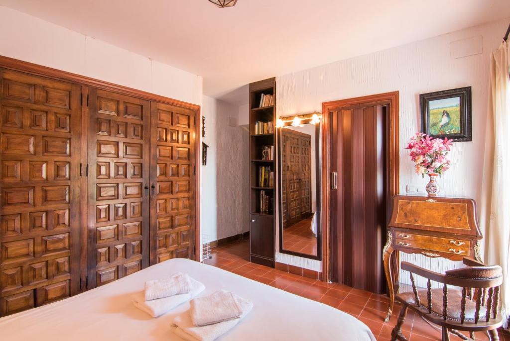 Postel nebo postele na pokoji v ubytování Country House Monachil