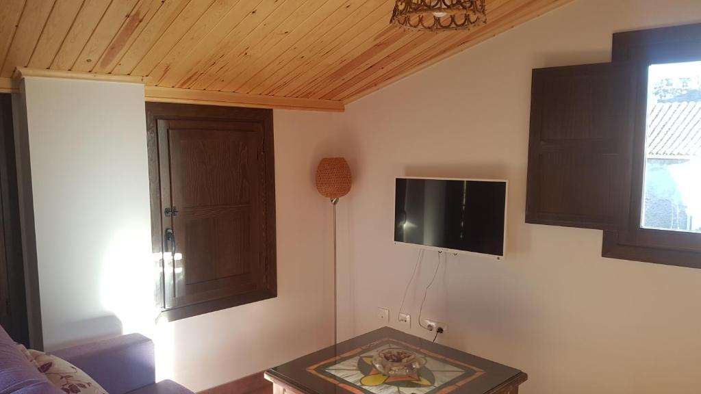 TV a/nebo společenská místnost v ubytování Apartamentos Plan Dulcis