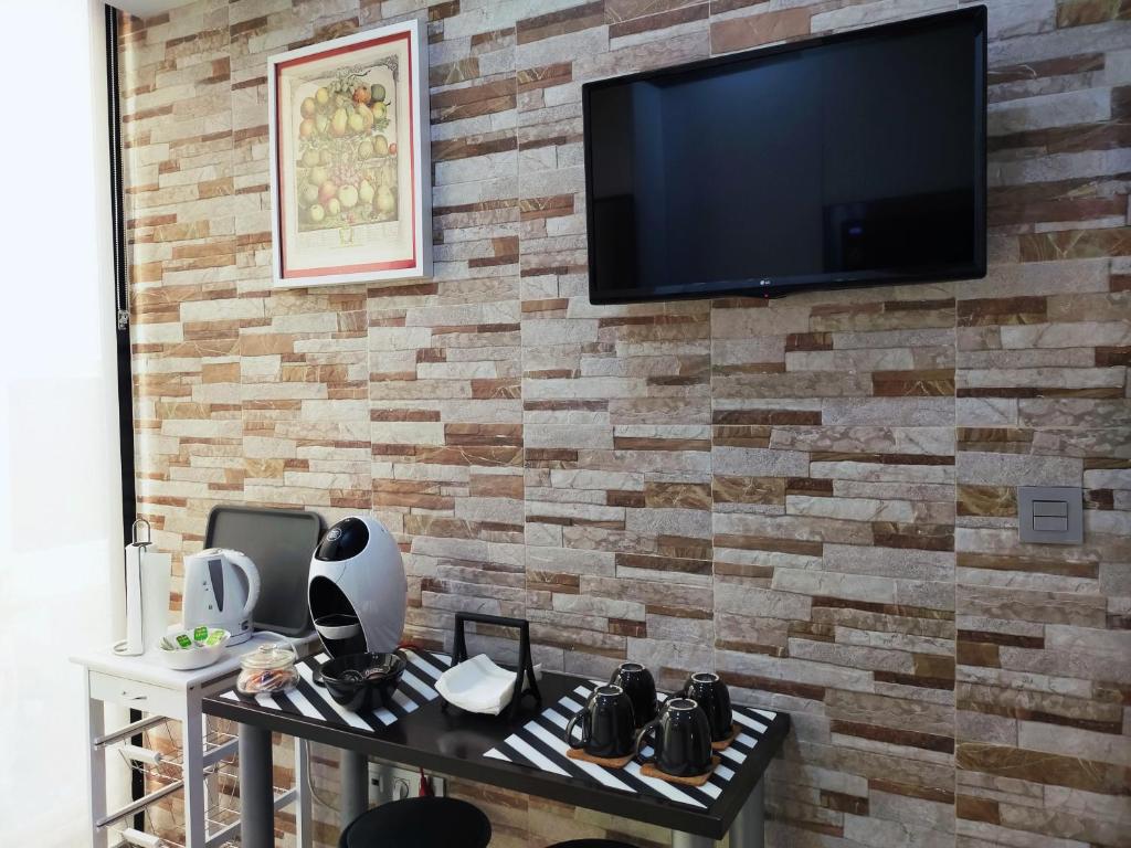 TV a/nebo společenská místnost v ubytování BOHEMIAN & SUITES PANORAMIC -parking