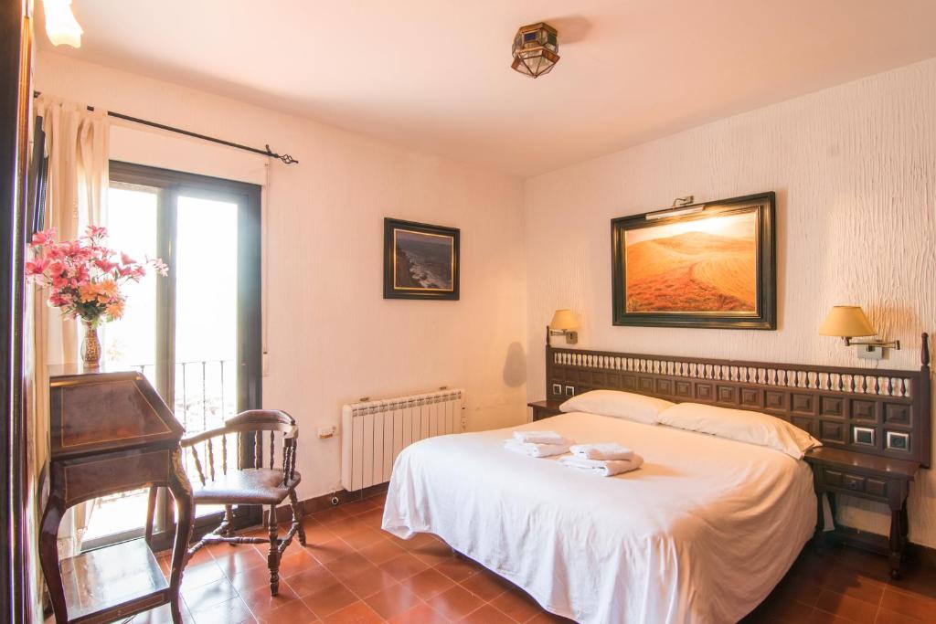 Postel nebo postele na pokoji v ubytování Country House Monachil