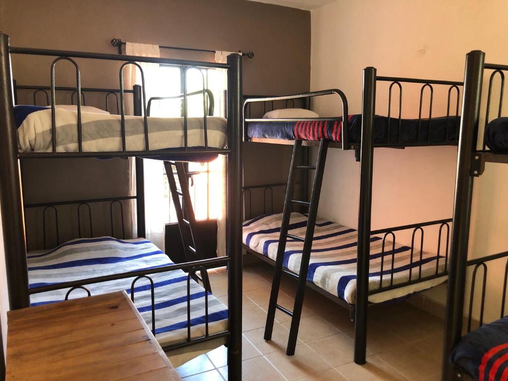 Postel nebo postele na pokoji v ubytování Hostel Inn