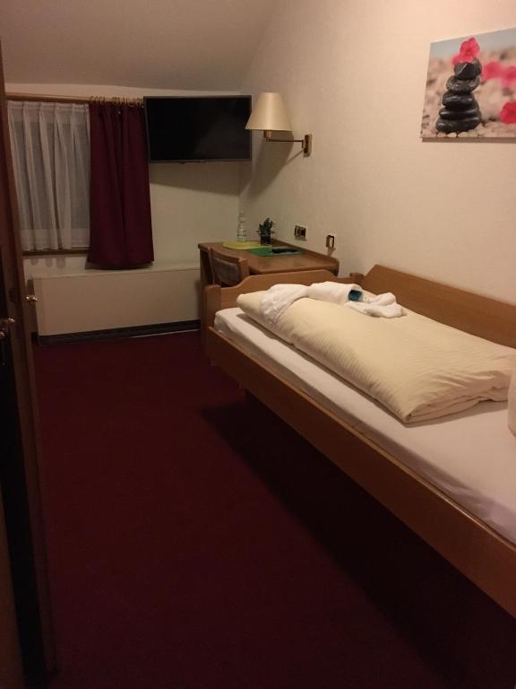 Postel nebo postele na pokoji v ubytování Hotel & Restaurant Druidenstein