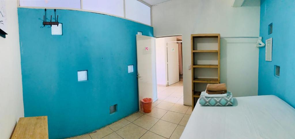 Postel nebo postele na pokoji v ubytování Hostal Bucerias