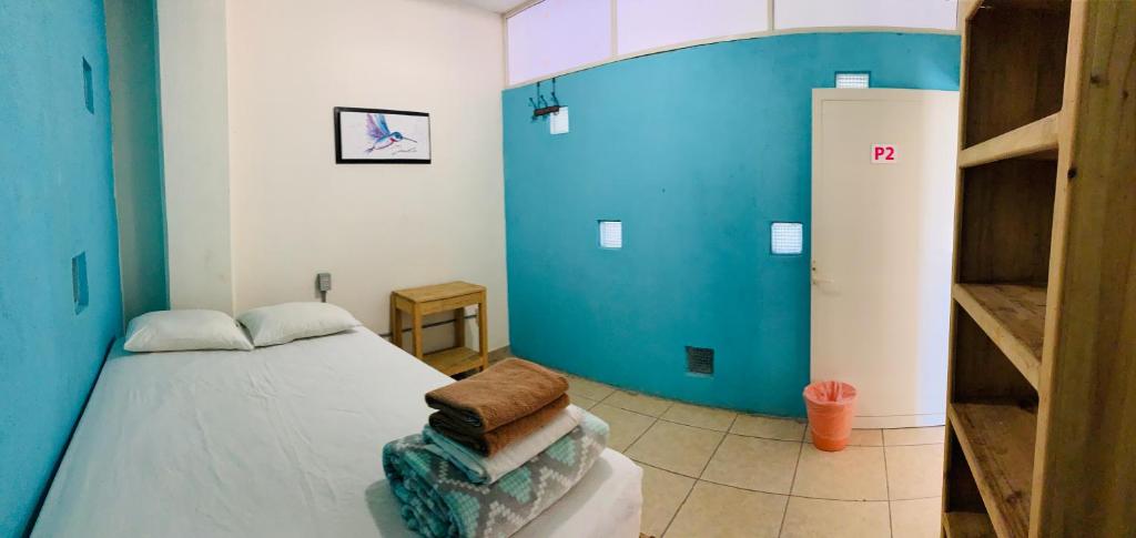 Postel nebo postele na pokoji v ubytování Hostal Bucerias