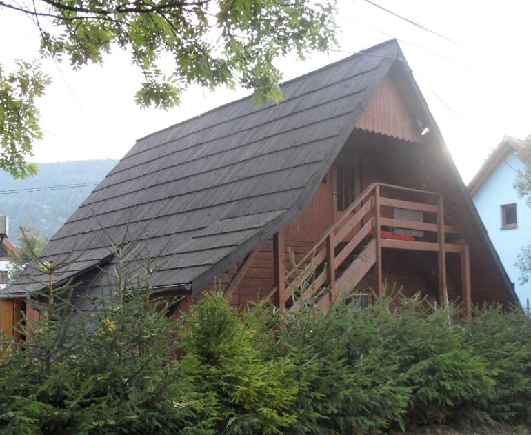 a large wooden house with a black roof at Chata Habovka in Habovka