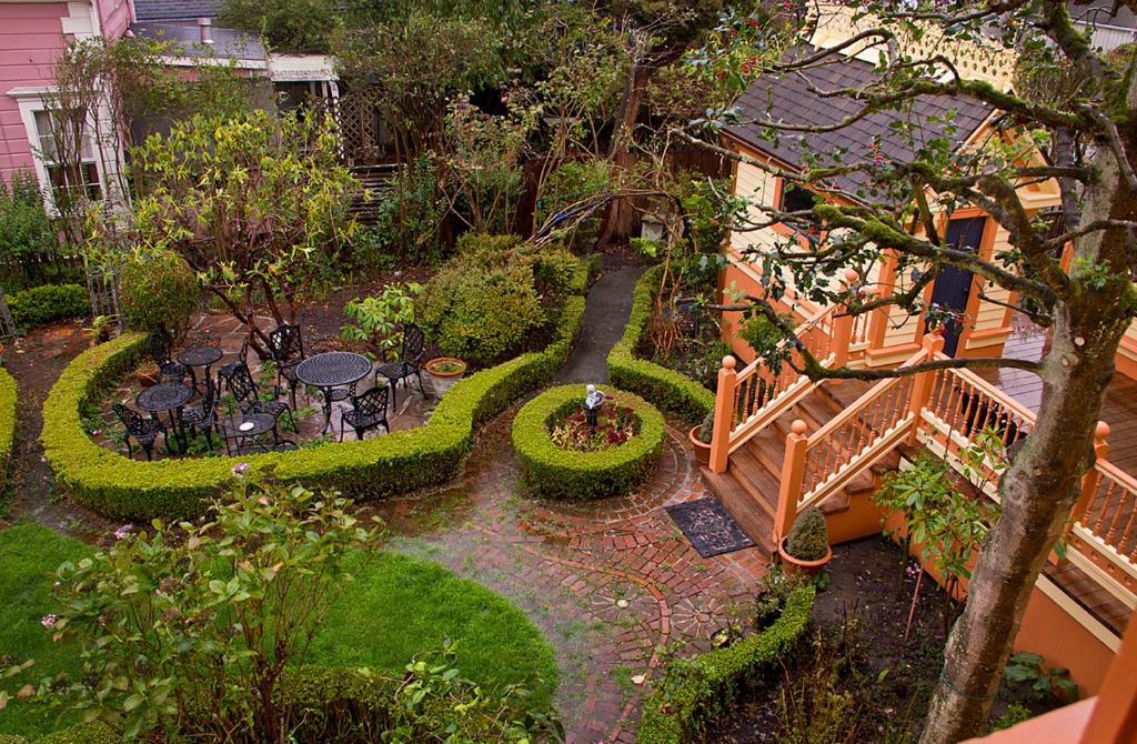 an aerial view of a garden with tables and chairs at Gingerbread Mansion in Ferndale