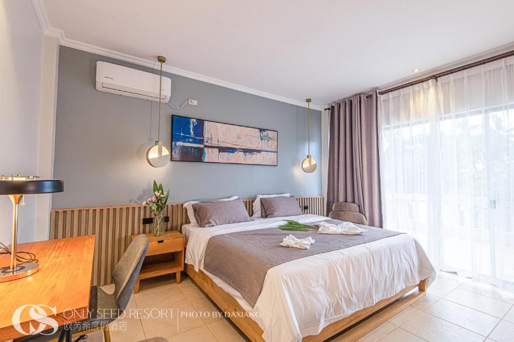 Postel nebo postele na pokoji v ubytování Only Seed Resort 欧芮希度假酒店