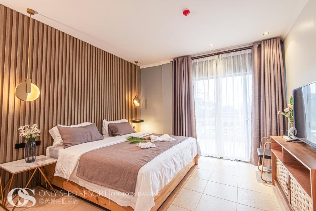 Postel nebo postele na pokoji v ubytování Only Seed Resort 欧芮希度假酒店