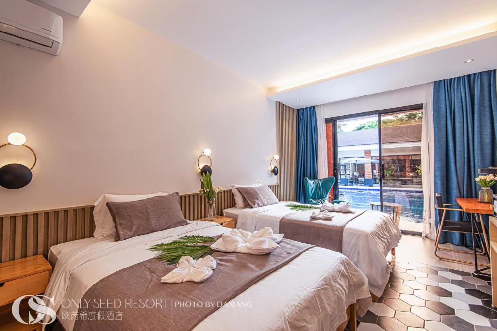 Postel nebo postele na pokoji v ubytování Only Seed Resort 欧芮希度假酒店