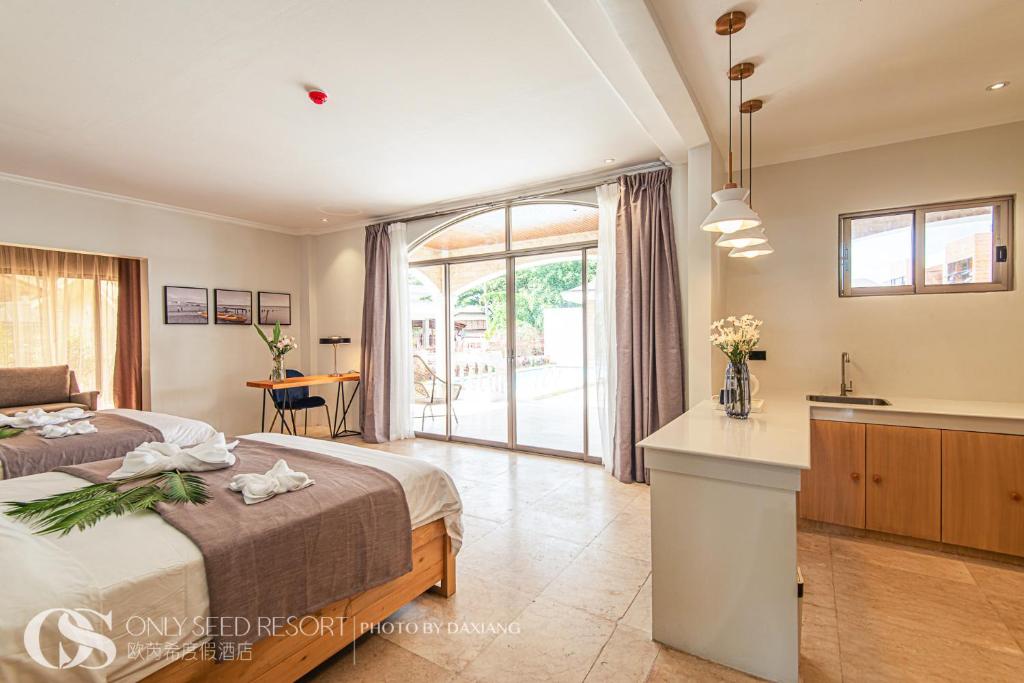 Postel nebo postele na pokoji v ubytování Only Seed Resort 欧芮希度假酒店