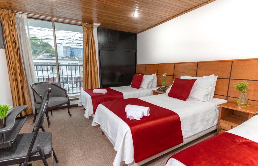 Postel nebo postele na pokoji v ubytování Hotel Casa Quinta Embajada