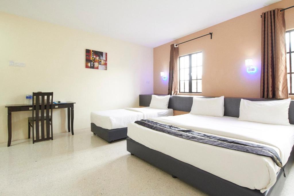 Postel nebo postele na pokoji v ubytování M S Hotel, Tengku Kelana KTM Klang
