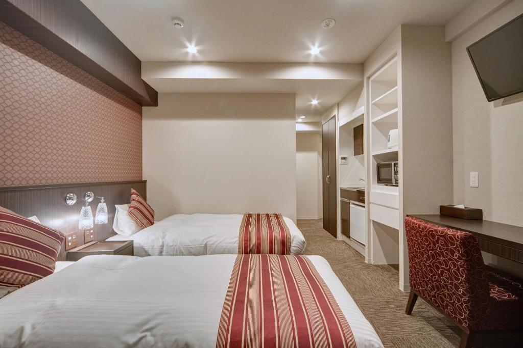 Postel nebo postele na pokoji v ubytování Hotel Amaterrace Yosuga