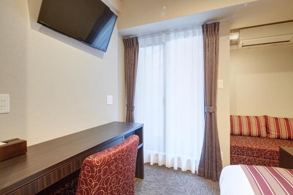 TV a/nebo společenská místnost v ubytování Hotel Amaterrace Yosuga