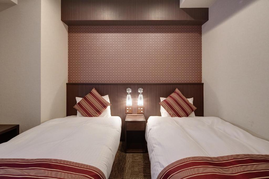 Postel nebo postele na pokoji v ubytování Hotel Amaterrace Yosuga