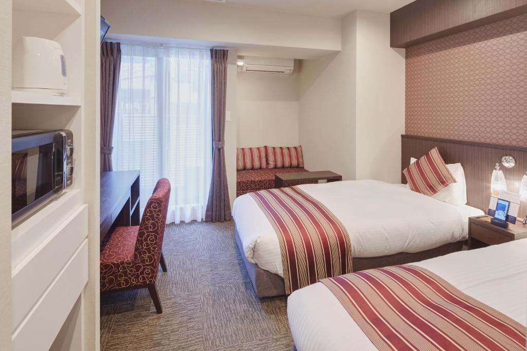 Postel nebo postele na pokoji v ubytování Hotel Amaterrace Yosuga
